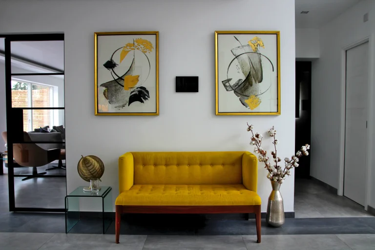 Entrance Hallway, showing sofa and a Control4 touchscreen on the wall.