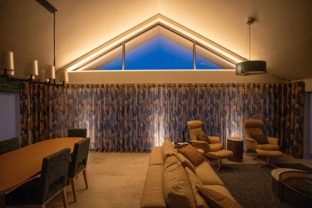 Living room at night at our smart home project in Sussex